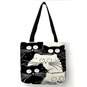 Funny cartoon black and white cat tote bag